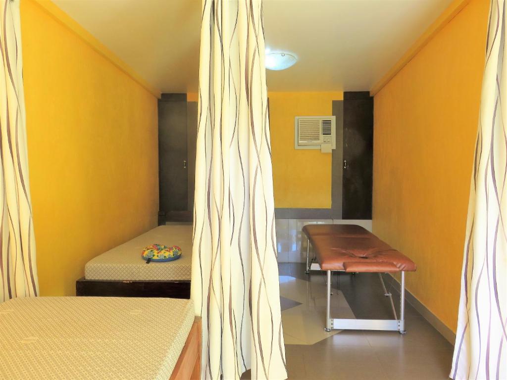 Postel nebo postele na pokoji v ubytování Malapascua Garden Resort