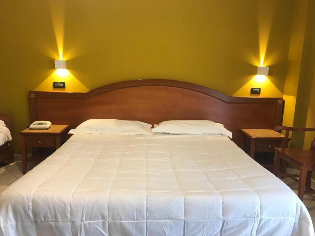 Postel nebo postele na pokoji v ubytování Hotel Parco Delle Rose