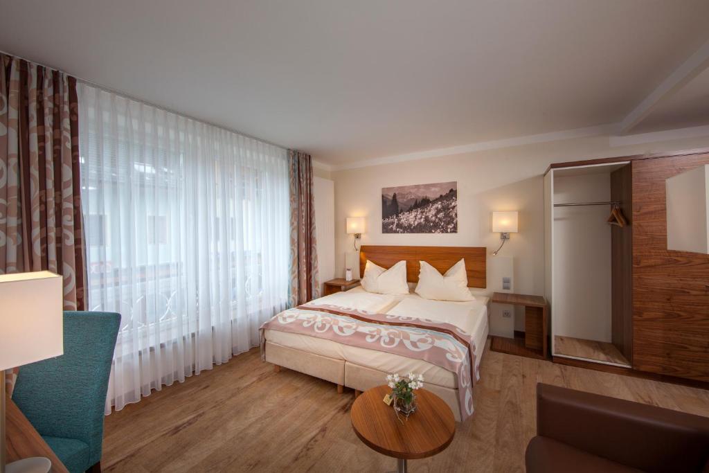 Postel nebo postele na pokoji v ubytování Hotel Greinwald