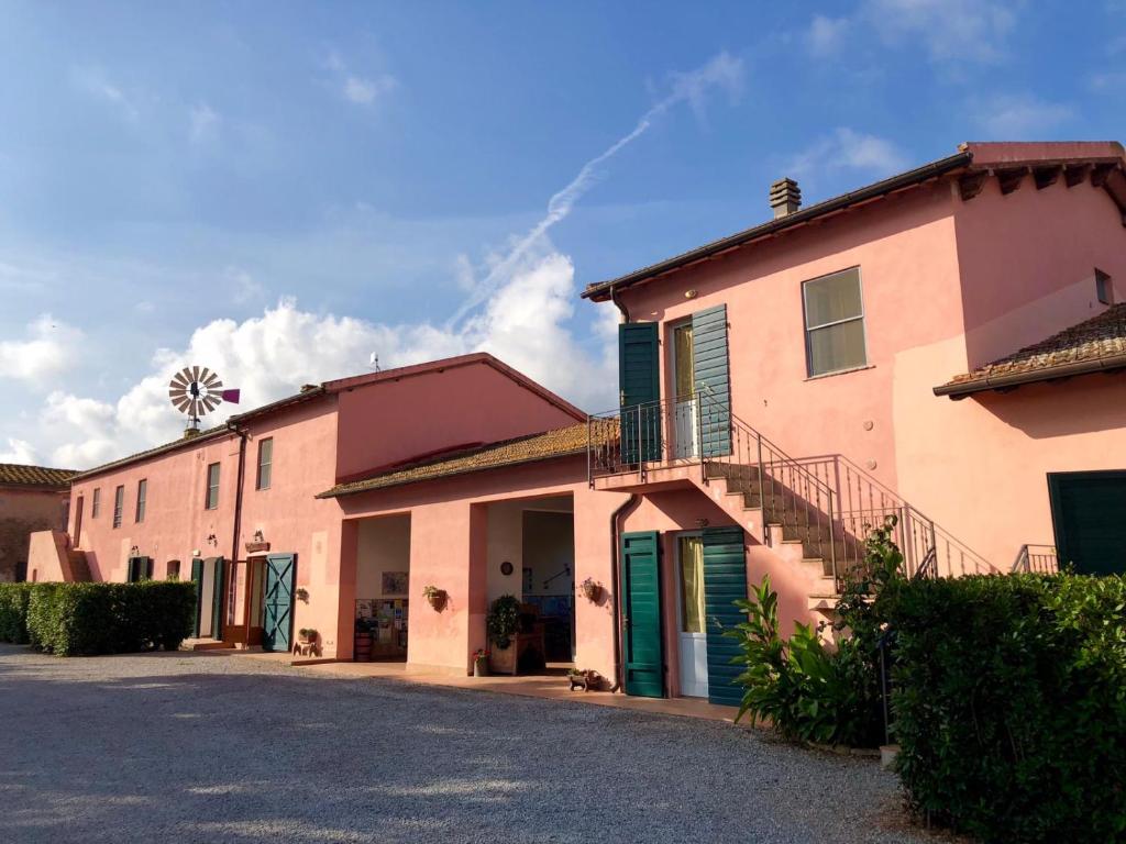 a building with a staircase on the side of it at Agriturismo Ristorante Monte Argentario in Monte Argentario