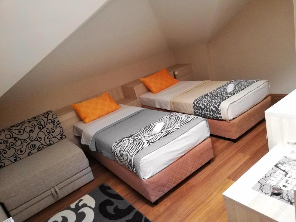 Postel nebo postele na pokoji v ubytování Hotel Bulevar