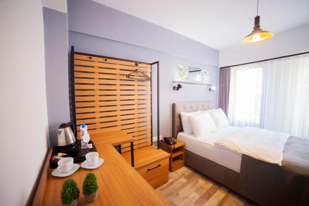 Postel nebo postele na pokoji v ubytování Set Özer Hotel