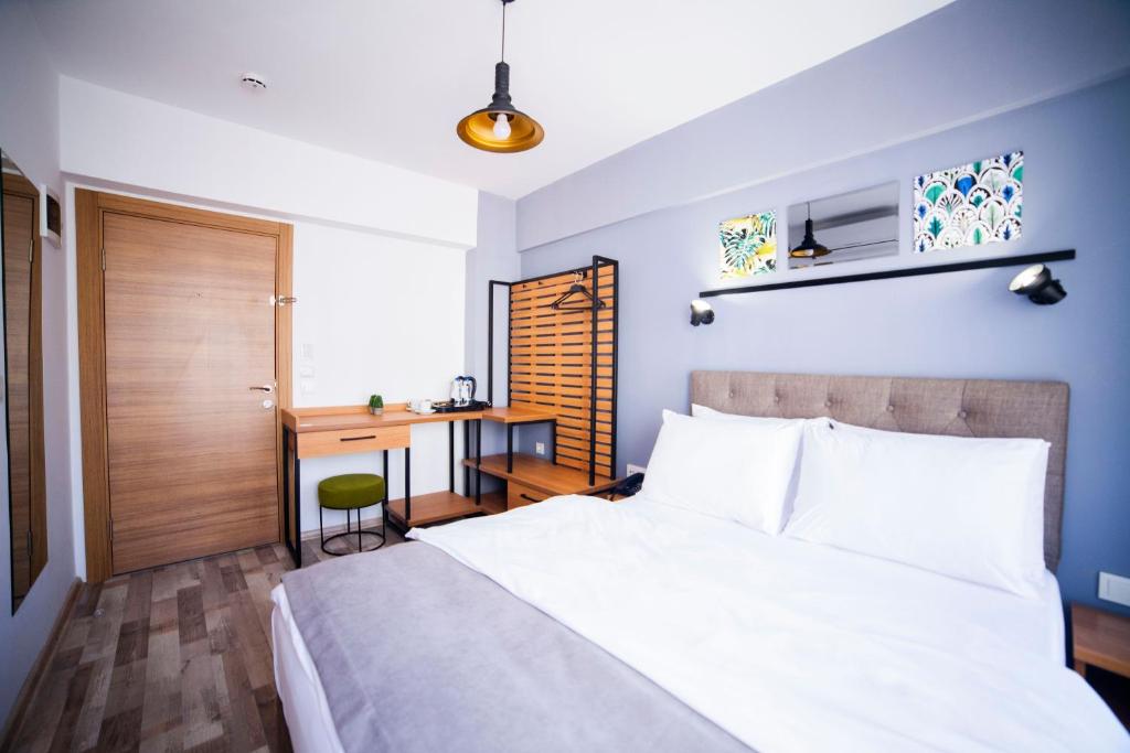 Postel nebo postele na pokoji v ubytování Set Özer Hotel