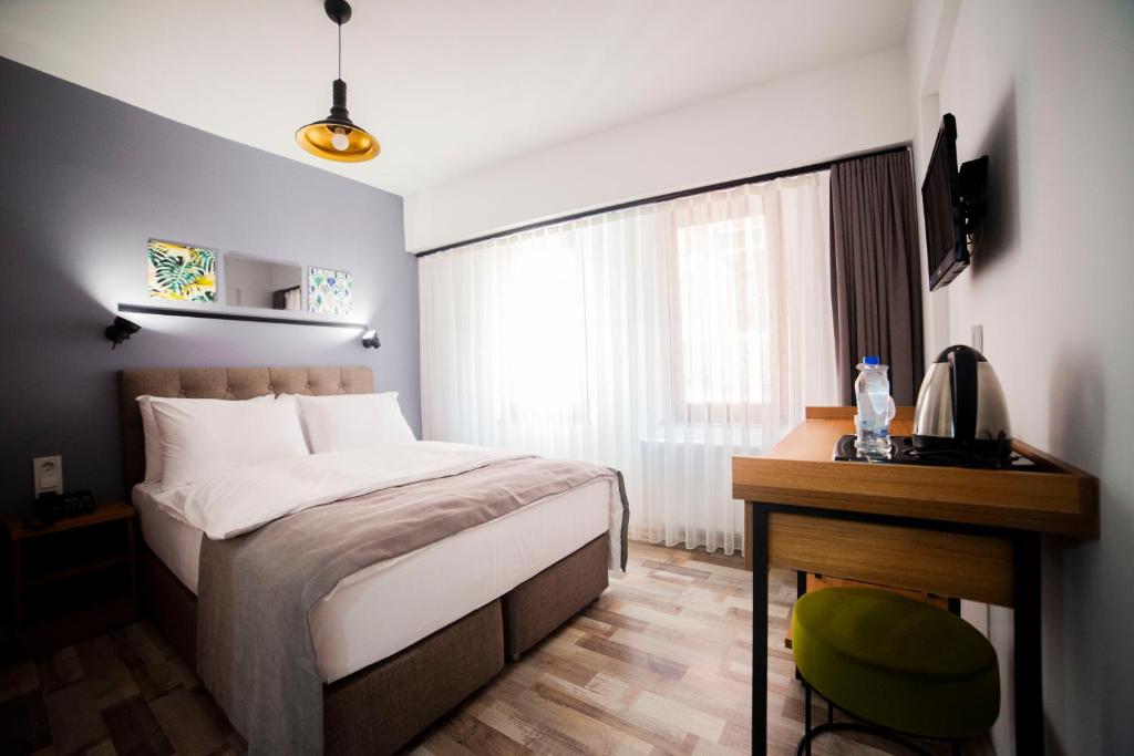 Postel nebo postele na pokoji v ubytování Set Özer Hotel