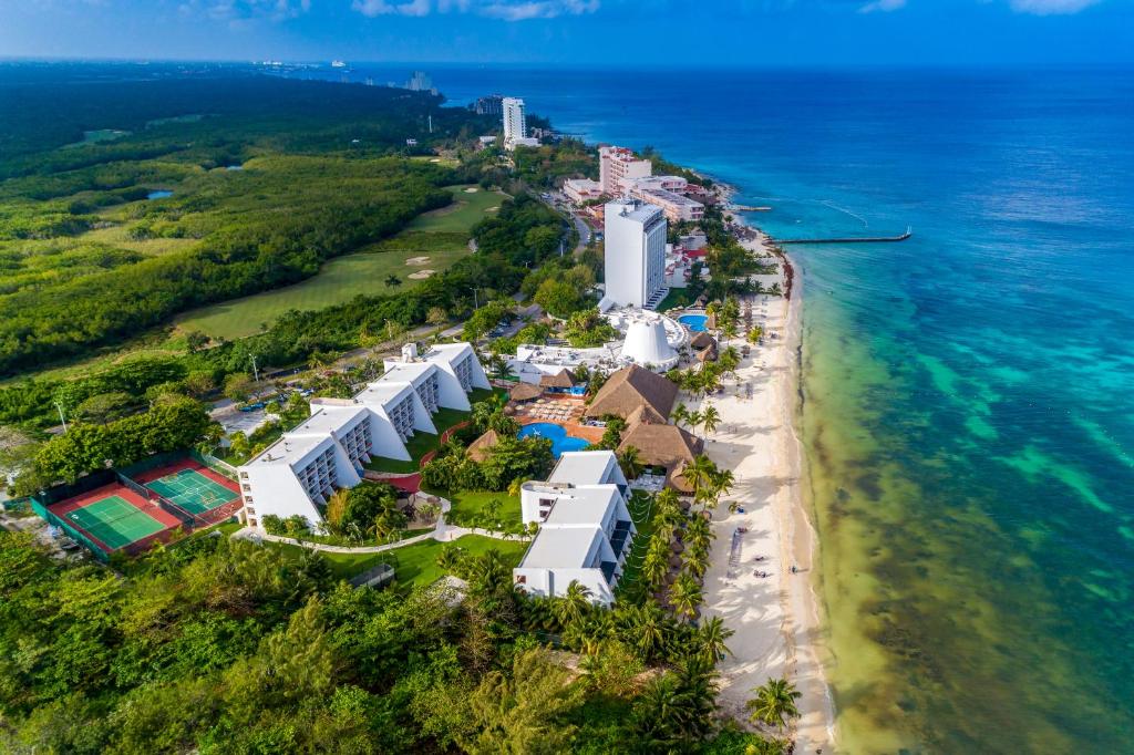 an aerial view of a resort on the beach at Melia Cozumel All Inclusive in Cozumel