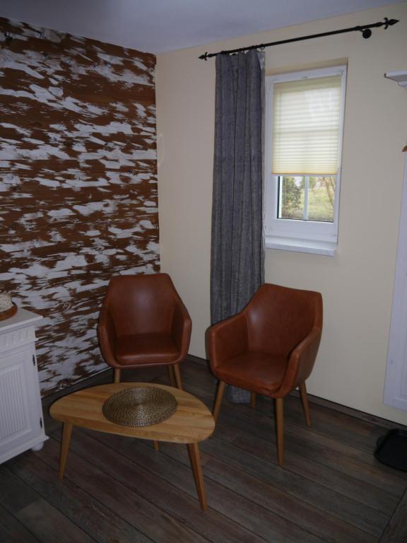Posezení v ubytování Café im Hof- Bed & Breakfast
