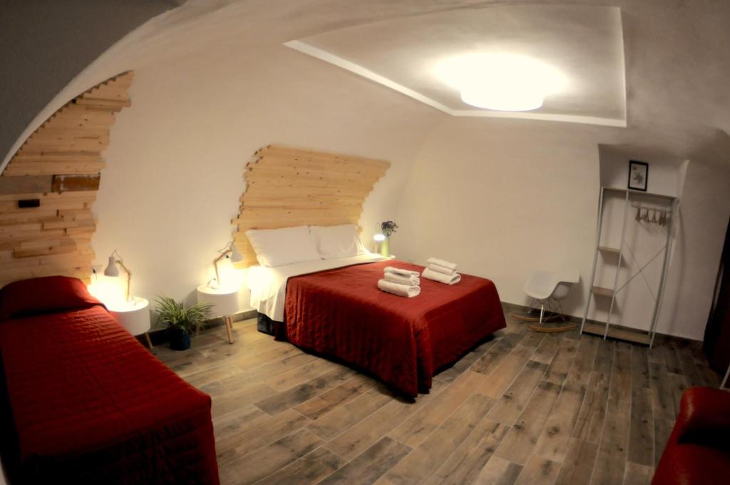 Posteľ alebo postele v izbe v ubytovaní The Foria House by House In Naples