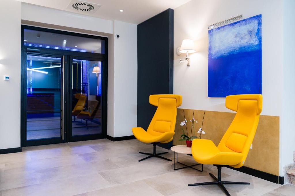 Χώρος καθιστικού στο Hotel Forum Garni
