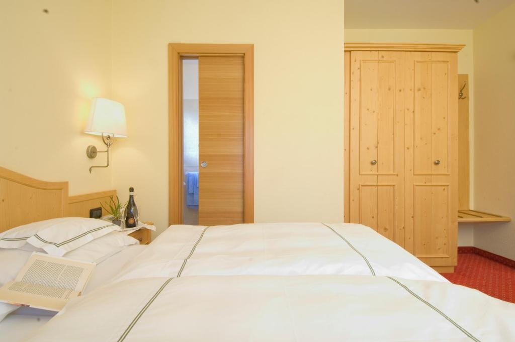 Postel nebo postele na pokoji v ubytování Hotel del Bosco