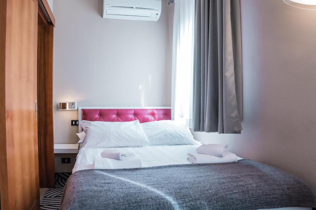 Postel nebo postele na pokoji v ubytování Hotel Cannaregio 2357