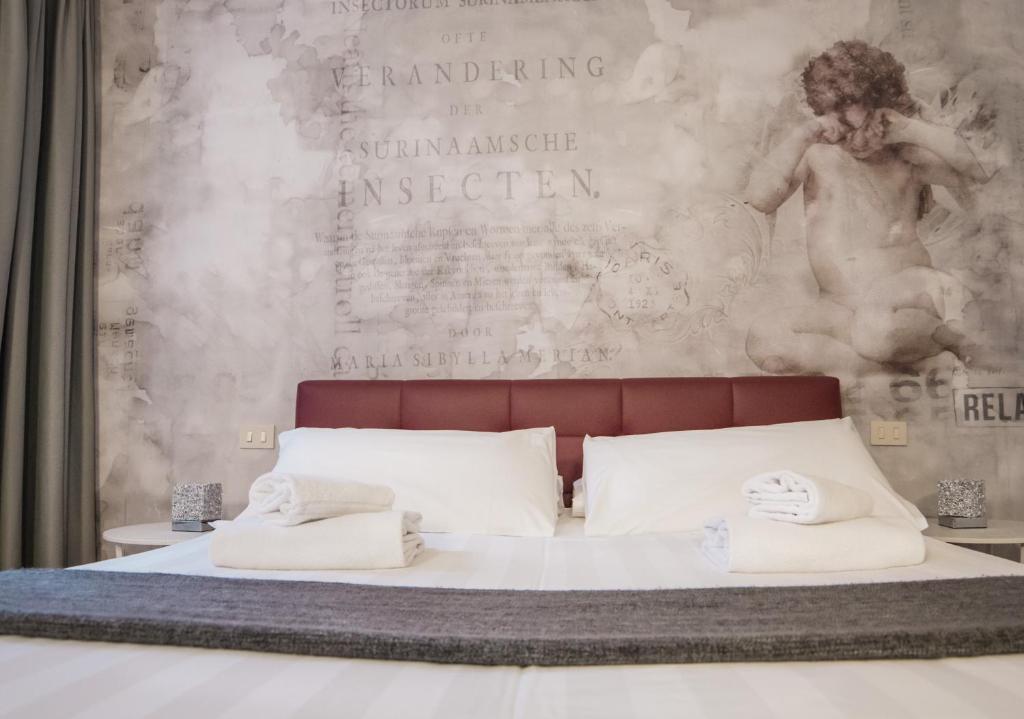 Postel nebo postele na pokoji v ubytování Hotel Cannaregio 2357