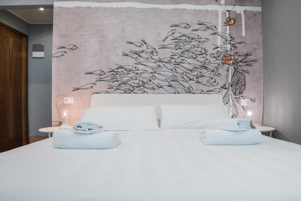 Postel nebo postele na pokoji v ubytování Hotel Cannaregio 2357