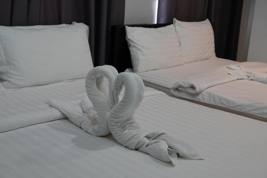 Postel nebo postele na pokoji v ubytování ibeyond Apartment Romklao Suvarnabhumi