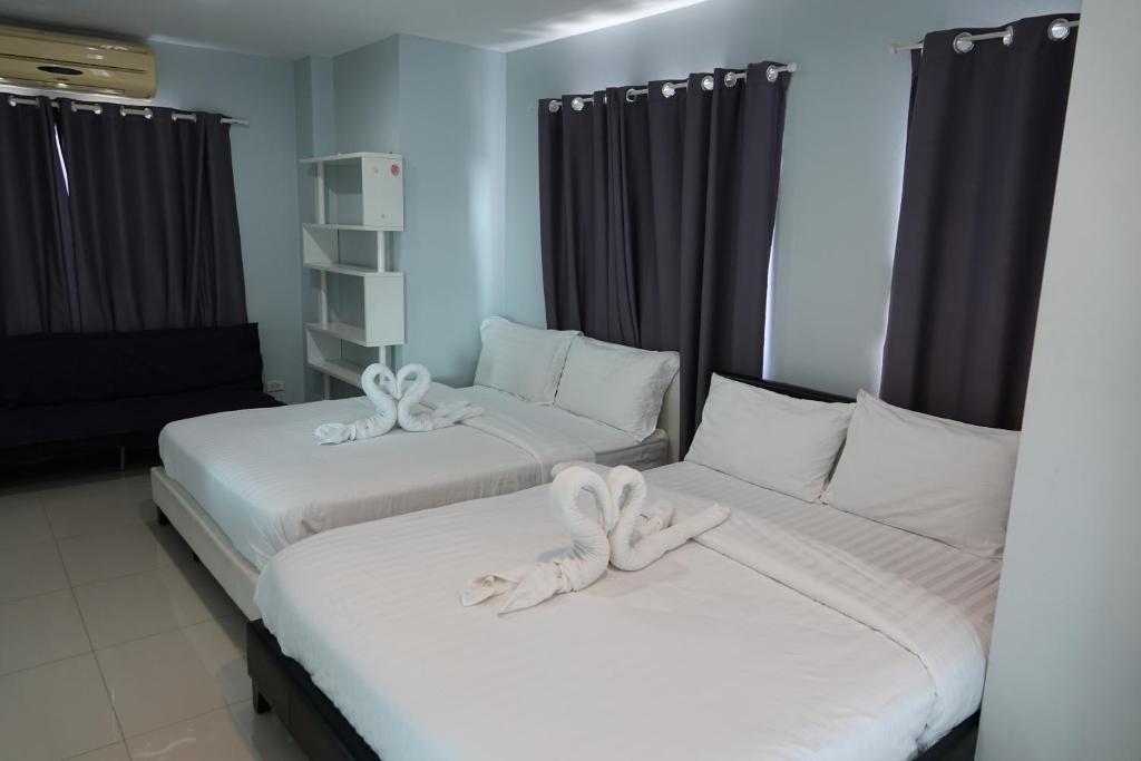 Postel nebo postele na pokoji v ubytování ibeyond Apartment Romklao Suvarnabhumi