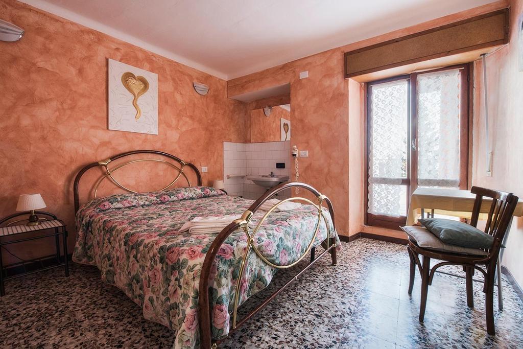 Postel nebo postele na pokoji v ubytování Baita Carla