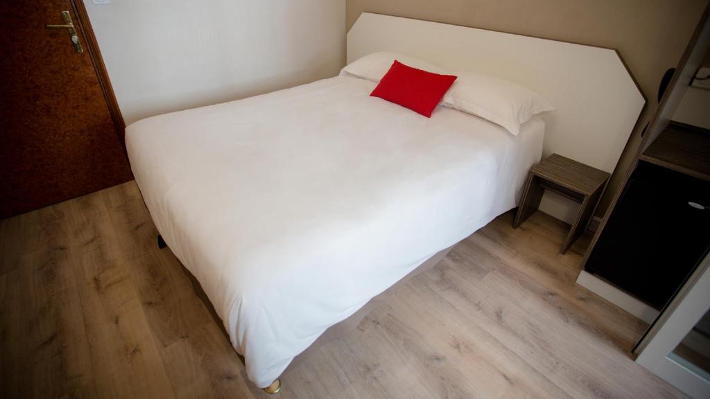 Postel nebo postele na pokoji v ubytování Hôtel Napoléon