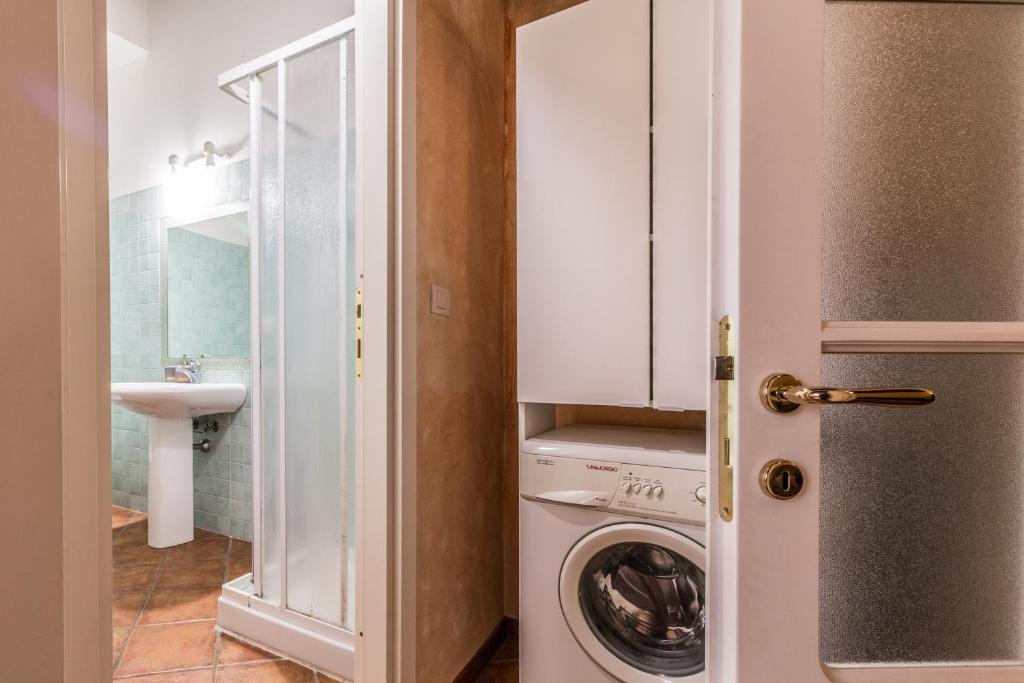 a laundry room with a washer and dryer at Design Apartments Sassari-Largo Cavallotti in Sassari