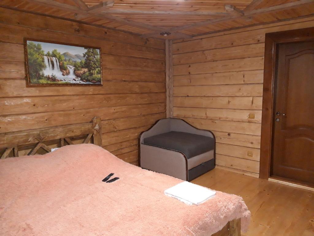 Postel nebo postele na pokoji v ubytování Synevyrskyj Chardash