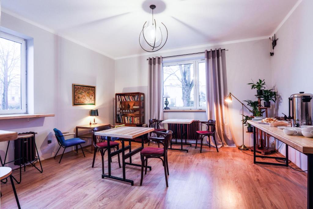 a dining room with a table and chairs at B&B Kraszewskiego3A in Bydgoszcz