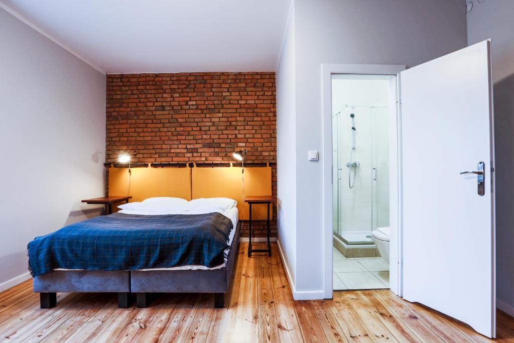 Posteľ alebo postele v izbe v ubytovaní B&B Kraszewskiego3A