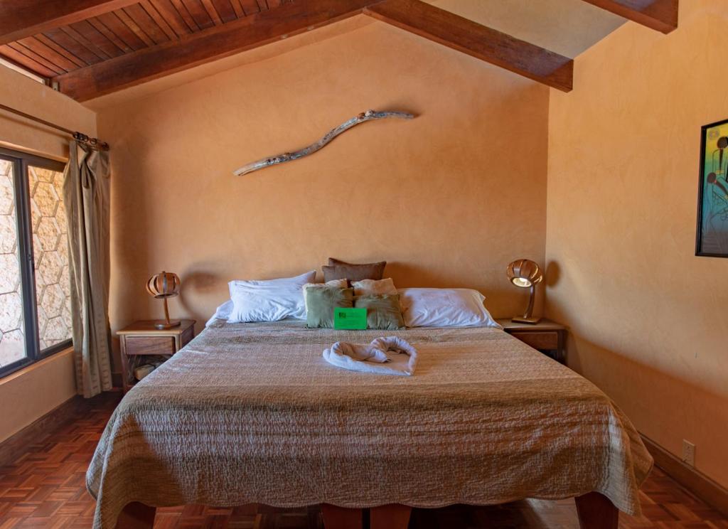 Postel nebo postele na pokoji v ubytování Villa Mango B&B