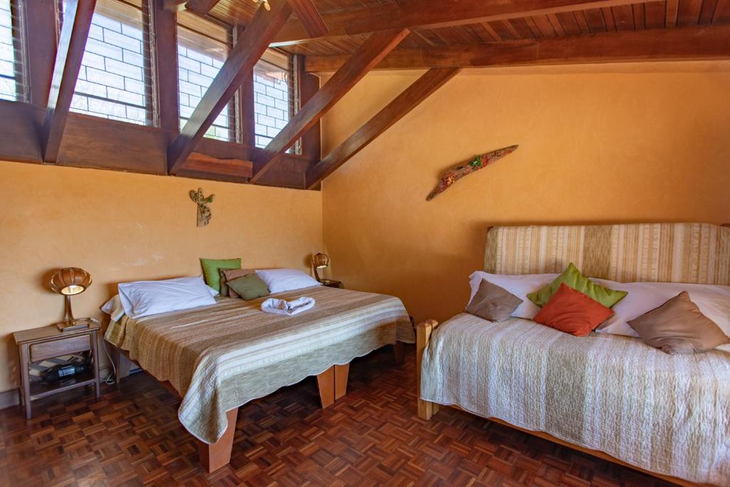 Postel nebo postele na pokoji v ubytování Villa Mango B&B