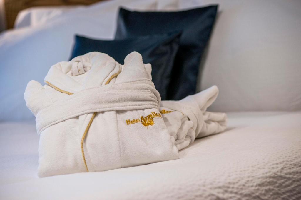 Postel nebo postele na pokoji v ubytování Hotel Arnika