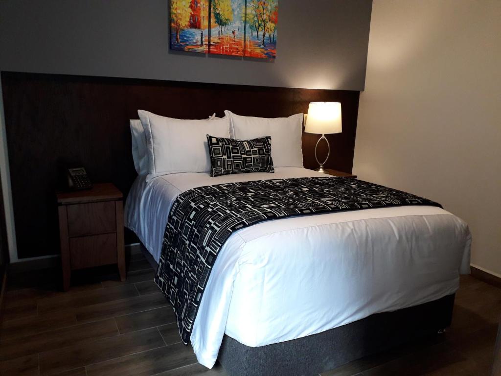 Postel nebo postele na pokoji v ubytování Hotel Corral Grande