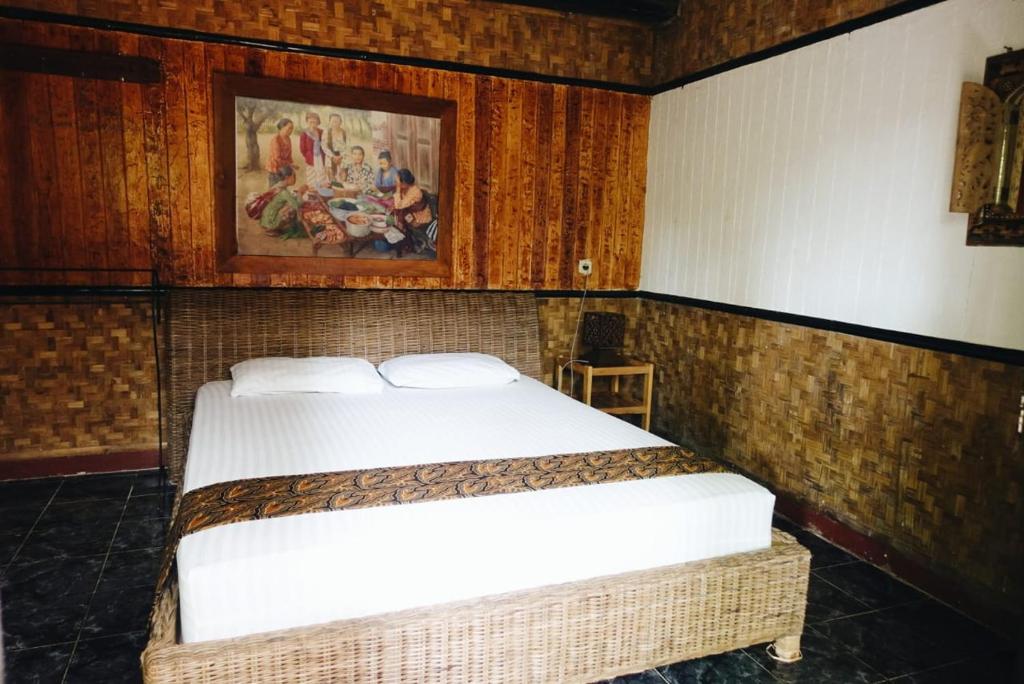 Postel nebo postele na pokoji v ubytování Mini Tiga Homestay