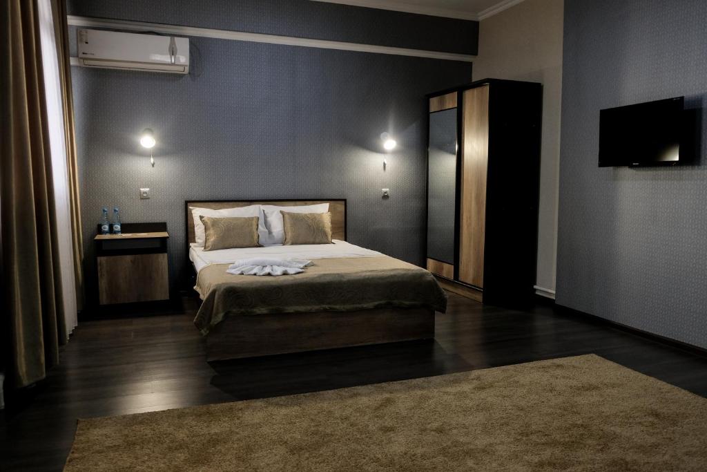 Postel nebo postele na pokoji v ubytování ORIENT