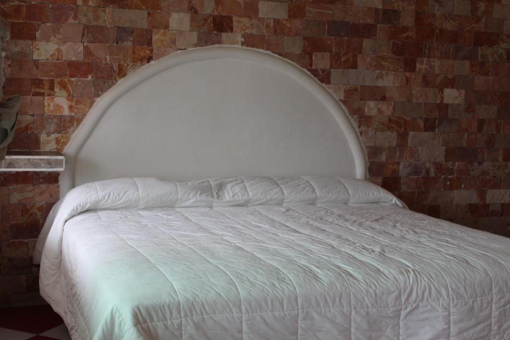 Postel nebo postele na pokoji v ubytování Hotel Villas del Rey
