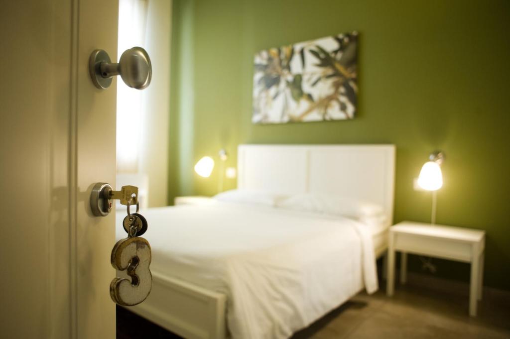 Postel nebo postele na pokoji v ubytování B&B Suite Paciotti
