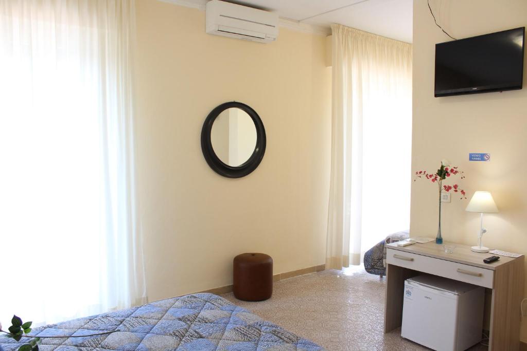 Postel nebo postele na pokoji v ubytování Hotel Luca