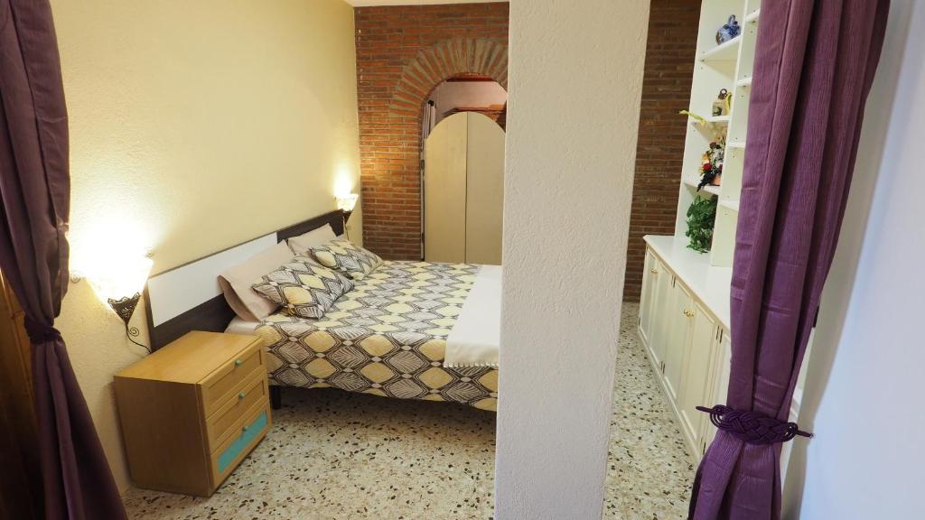 Postel nebo postele na pokoji v ubytování Villa Carolina