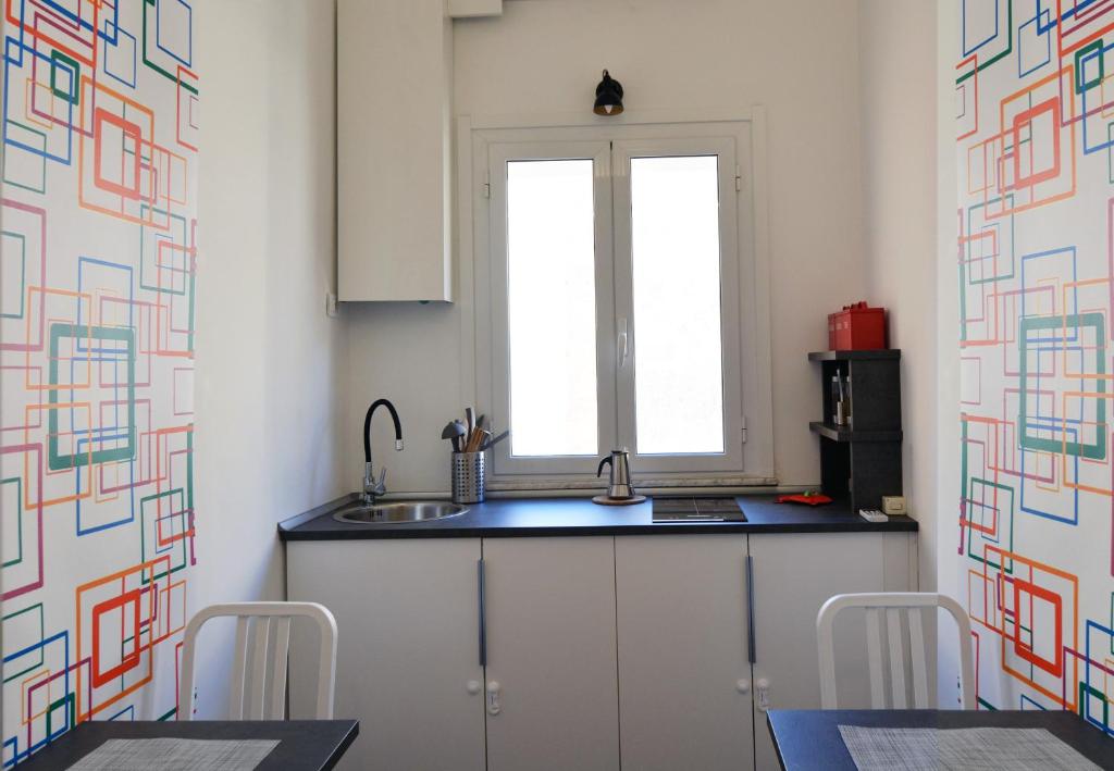A kitchen or kitchenette at Alloggio per uso turistico D'Ambrosio Antonella Gli Scipioni 53