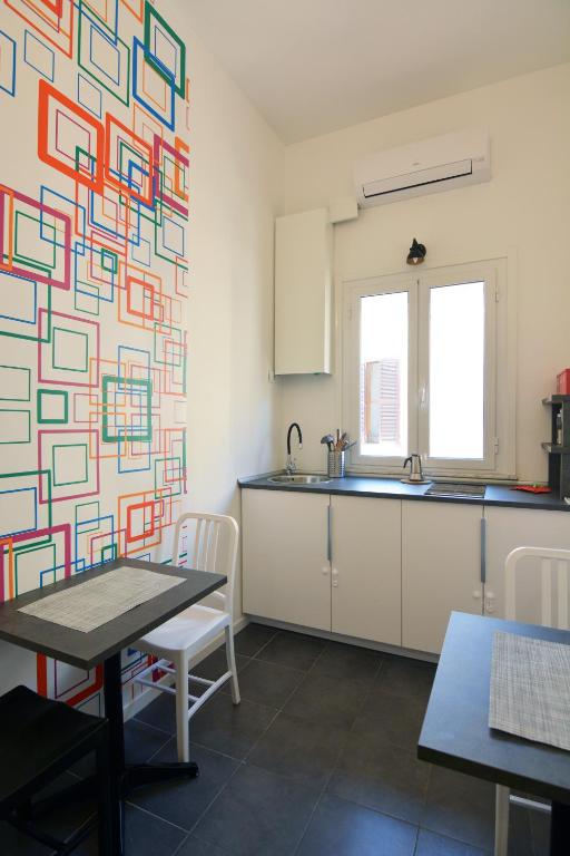 A kitchen or kitchenette at Alloggio per uso turistico D'Ambrosio Antonella Gli Scipioni 53