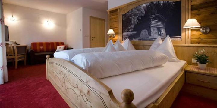 Posteľ alebo postele v izbe v ubytovaní Hotel Pfandleralm
