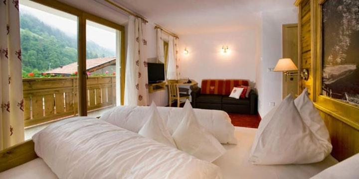 Posteľ alebo postele v izbe v ubytovaní Hotel Pfandleralm