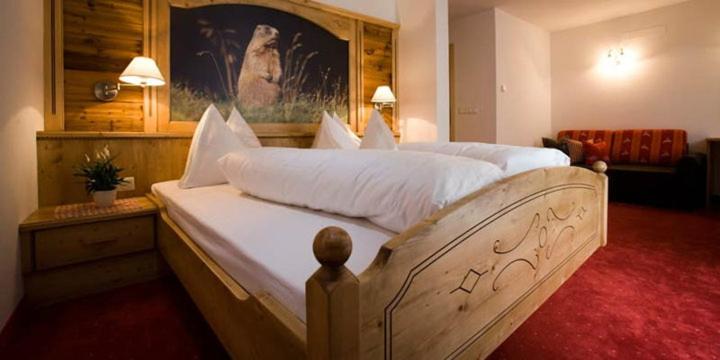 Posteľ alebo postele v izbe v ubytovaní Hotel Pfandleralm