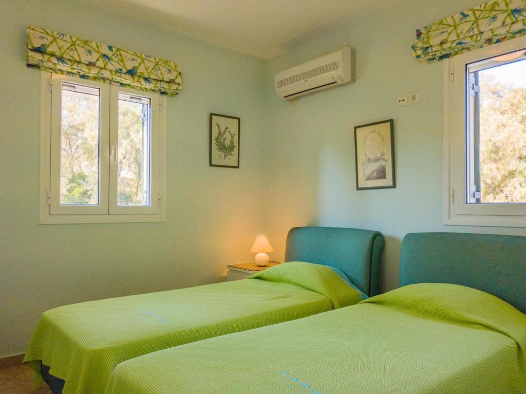 A bed or beds in a room at Kounopetra Beach Luxury Villas