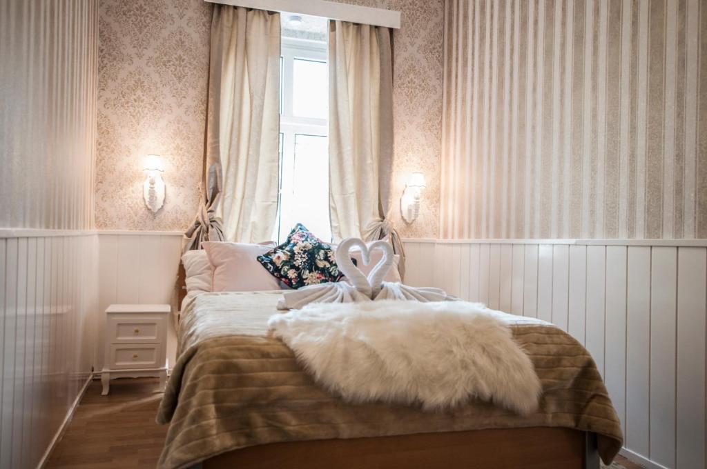 Postel nebo postele na pokoji v ubytování Urban Boutique Hotel