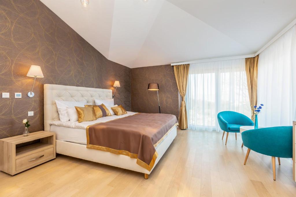 Postel nebo postele na pokoji v ubytování Villa Roko