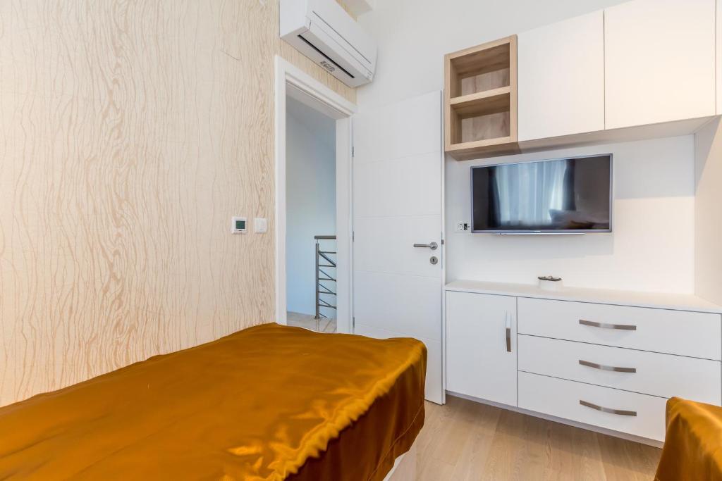 Postel nebo postele na pokoji v ubytování Villa Roko