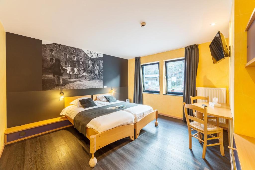 Postel nebo postele na pokoji v ubytování Hôtel Val de Poix- Logis Hôtel Restaurant