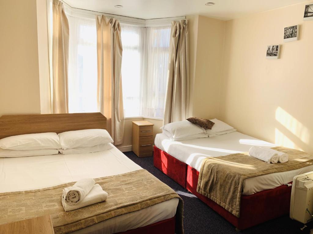 Krevet ili kreveti u jedinici u objektu Britannia Inn Hotel