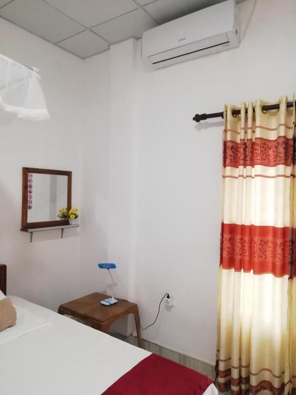 Postel nebo postele na pokoji v ubytování BAS Home Stay