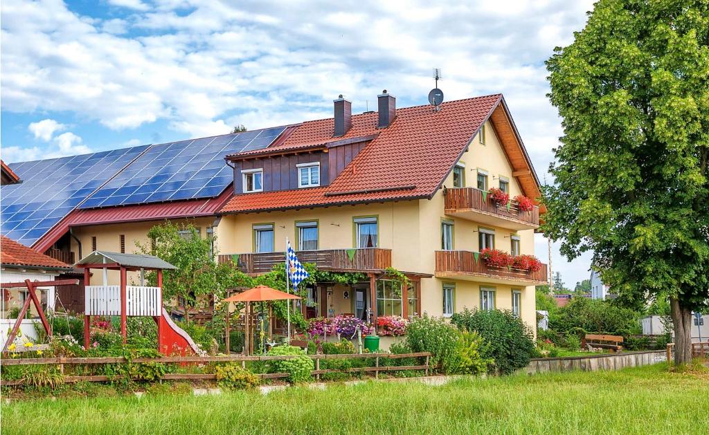 a house with solar panels on top of it at Steffi's Landhof in Bad Wörishofen