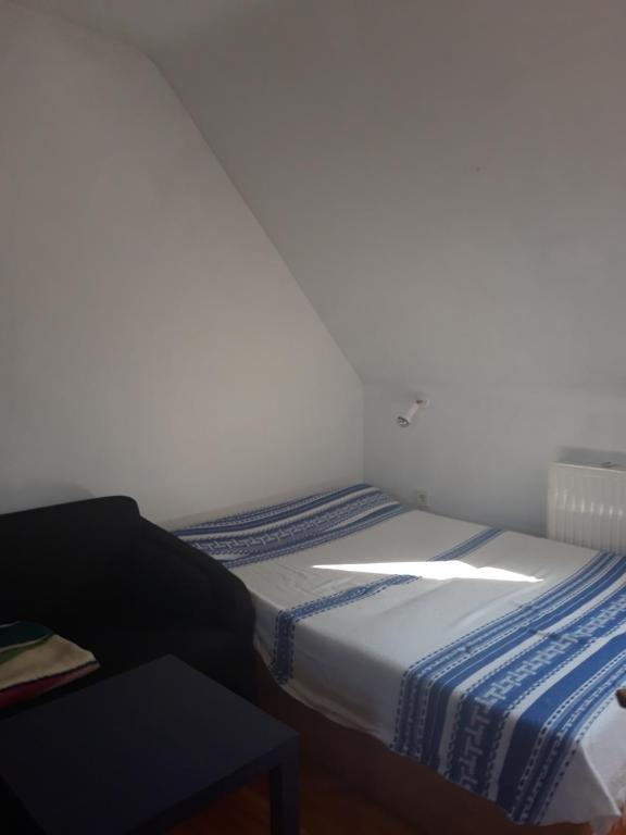 Postel nebo postele na pokoji v ubytování Zsigmond Ház