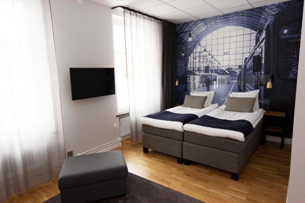 Postel nebo postele na pokoji v ubytování Livin Station Hotel