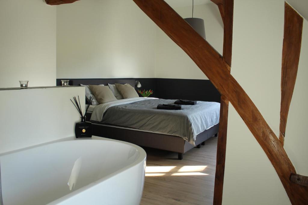 Postel nebo postele na pokoji v ubytování B&B Dageraad